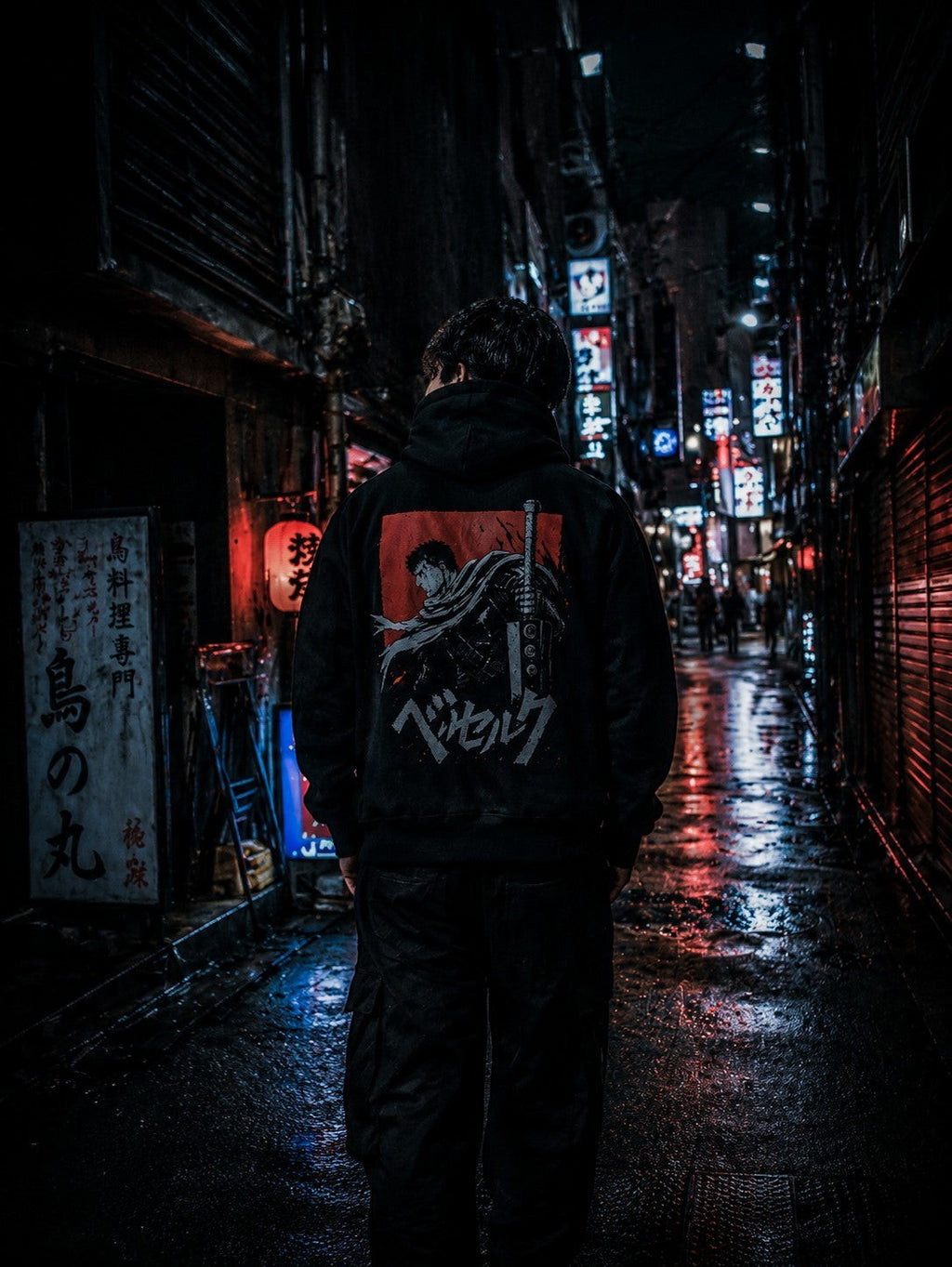 Drip&Verse black fleece hoodie with boxy fit, featuring a back graphic inspired by anime. Model is 6'1" wearing size M.