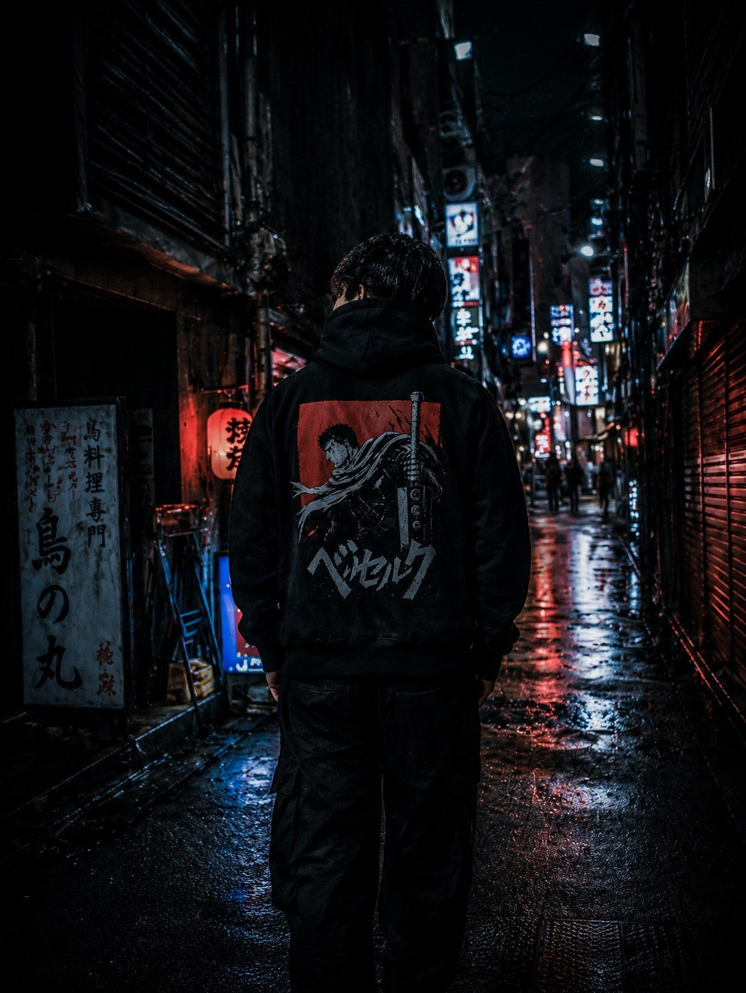 Drip&Verse black fleece hoodie with boxy fit, featuring a back graphic inspired by anime. Model is 6'1" wearing size M.