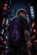 Drip&Verse black oversized 100% cotton tee with a purple graphic print of a skull and a figure. Model is 5'11" wearing size M.