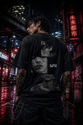 Drip&Verse black oversized 100% cotton t-shirt with fragmented black and white portraits on the back and a cracked graphic on the front.