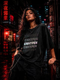 Drip&Verse black oversized 100% cotton tee with holographic gradient stacked typography. Model wears size M.
