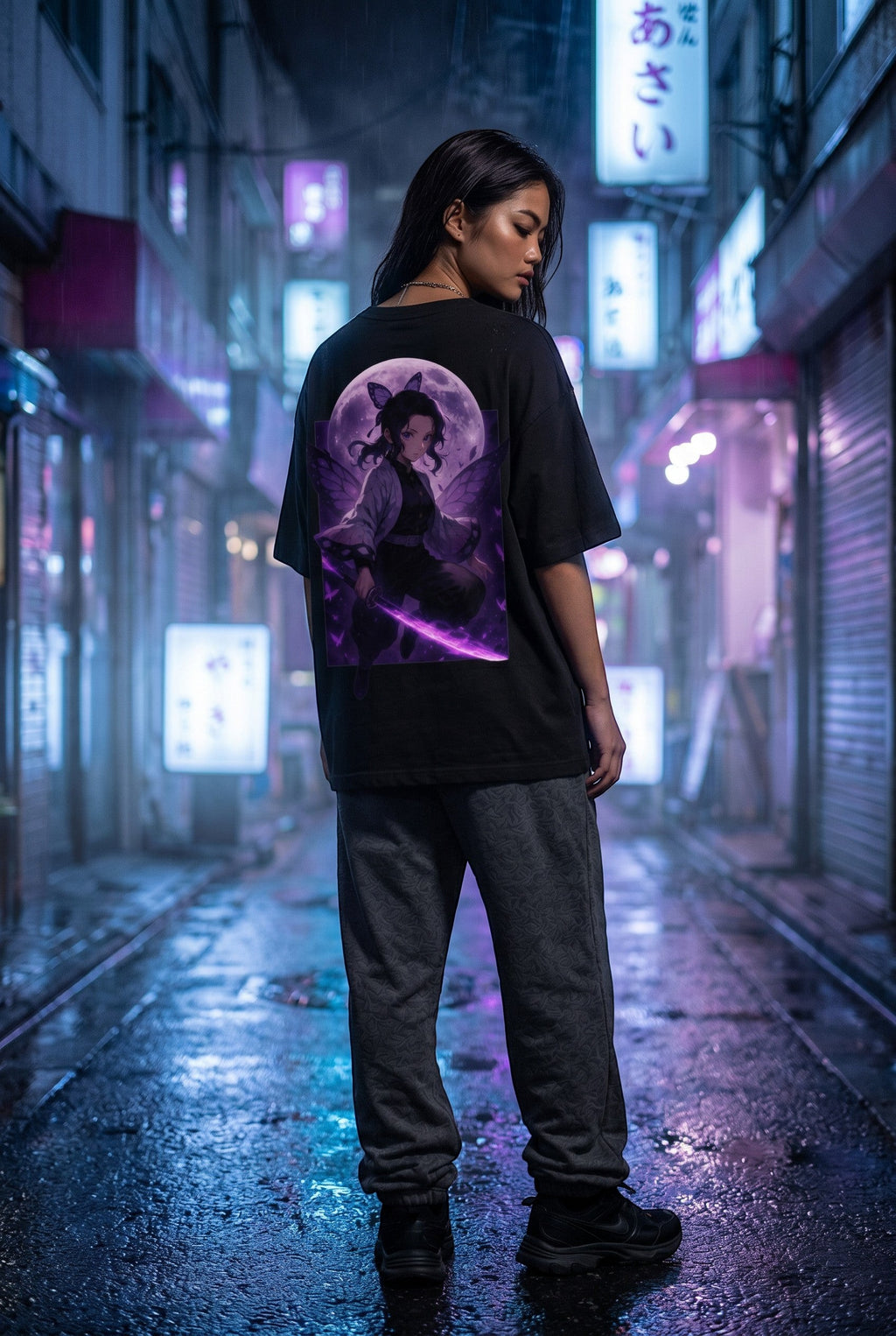 Drip&Verse black oversized 100% cotton tee with drop shoulders, featuring a full-color back print of an anime-style warrior with butterfly wings and a glowing purple sword against a full moon.